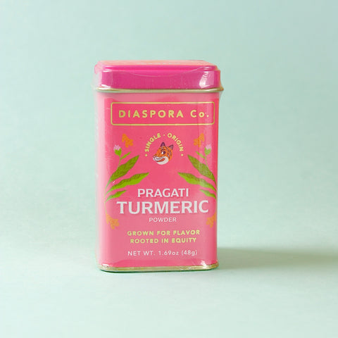 Diaspora Co Pragati Turmeric tin on blud background