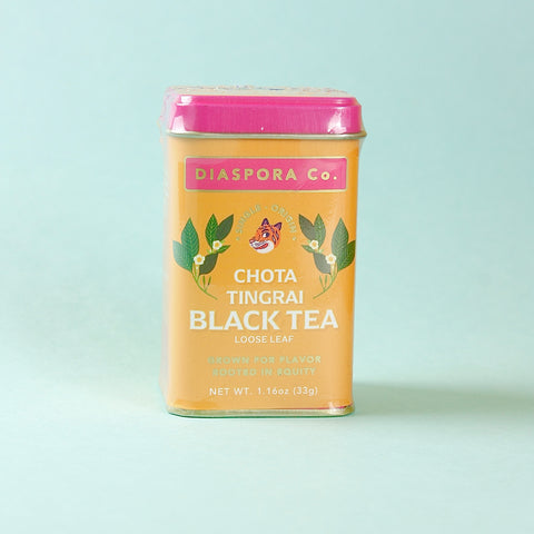 Diaspora Co. Chota Tingrai Black Tea canister on a light blue background